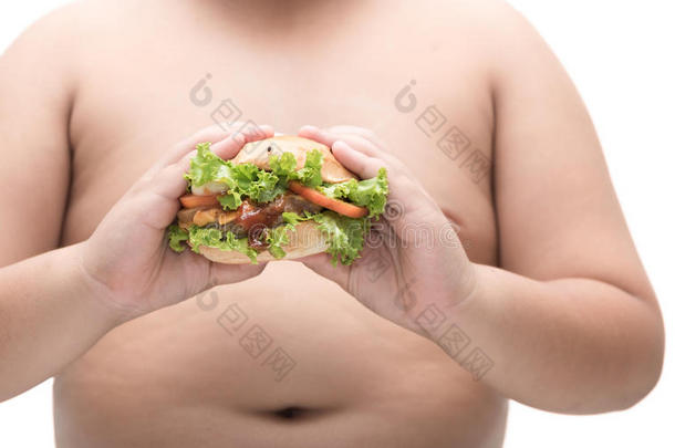 猪肉汉堡包采用极为肥胖的肥的男孩手隔离的.