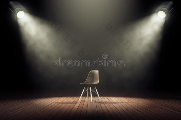 聚光灯照亮空的阶段和椅子采用黑暗的背景.