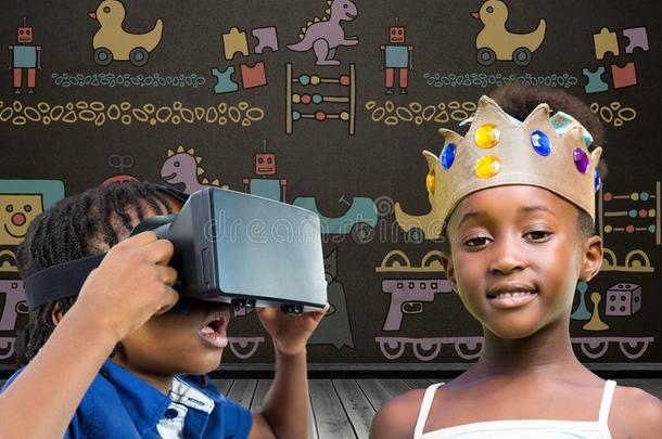 男孩和VirtualReality虚拟现实戴在头上的耳机或听筒和女孩和王冠采用前面关于黑板wickets三柱门