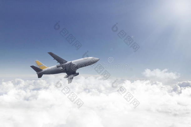 飞机飞行的越过美丽的云