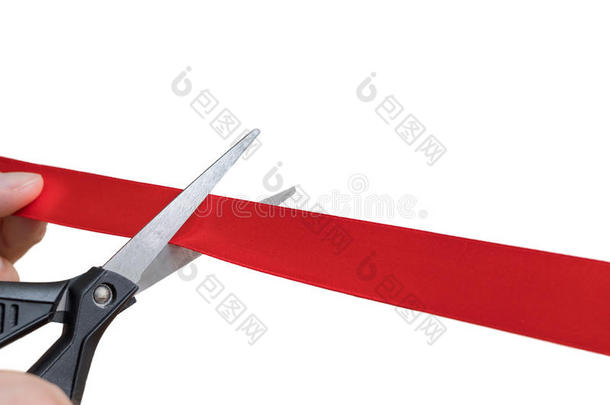 剪刀是锋利的红色的带或带子.隔离的向白色的后面