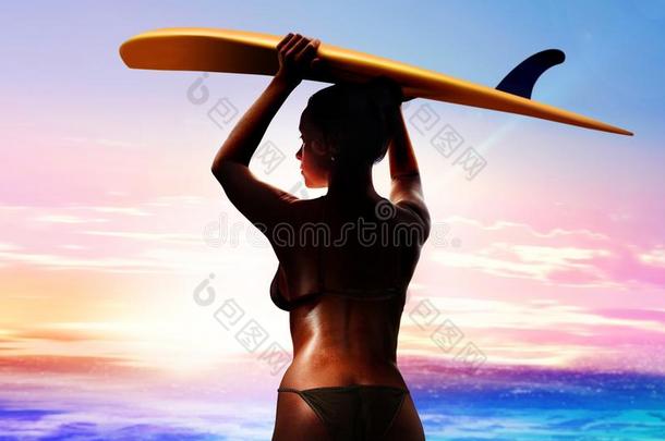 冲浪运动员和冲浪板在日出